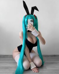  1girl blue_hair breasts cosplay hair_ornament hatsune_miku_(cosplay) highres large_breasts long_hair presenting rabbit rabbit_ears real_life selfie semi-nude sexually_suggestive solo  rating:Explicit score:28 user:ahegahotwhorespa