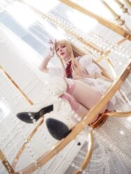  1girl ass blonde_hair boots cosplay cosplay_photo dress emilie_de_rochefort emilie_de_rochefort_(cosplay) fingerless_gloves gloves high_heels highres long_hair looking_at_viewer photo_(medium) real_life short_sleeves sitting sminky tekken tekken_8 thighs 