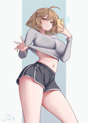  1girl aeon_ion ahoge alternate_costume anis_(nikke) black_shorts breasts brown_eyes brown_hair commentary dolphin_shorts goddess_of_victory:_nikke grey_shirt highres holding holding_phone large_breasts midriff navel phone selfie shirt short_hair shorts smile solo symbol-only_commentary thighs two-tone_background 