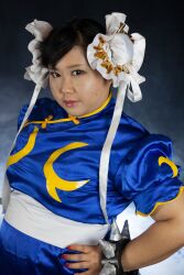  1girl asian black_hair capcom chun-li fat fat_woman female_focus highres photo_(medium) sakuran_watanabe solo street_fighter  rating:Questionable score:2 user:leejunne