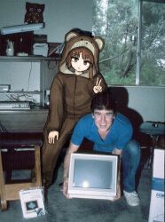  1boy 1girl animal_costume bear_costume black_hair blue_shirt brown_eyes brown_hair computer_keyboard crt desk indoors iwakura_lain long_sleeves looking_at_viewer photo_background real_life serial_experiments_lain shirt short_hair short_sleeves smile standing t-shirt terry_a_davis v window yuroroo 