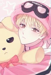 1boy blonde_hair bow brown_eyes closed_mouth debwi_mos_hamyeon_jugneun_byeong_geollim goggles goggles_on_head hair_between_eyes hat highres jacket korean_commentary looking_at_viewer lukapang male_focus park_moondae pink_background pink_hat pink_jacket red_bow short_hair solo stuffed_animal stuffed_dog stuffed_toy turtleneck turtleneck_jacket upper_body
