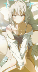 1girl absurdres animal_ear_fluff animal_ears bare_shoulders blue_archive blue_camisole blue_eyes blue_halo blue_shorts blurry blush camisole collarbone commentary_request crossed_wrists depth_of_field grey_hair halo highres kazueru knees_together_feet_apart lanyard long_sleeves looking_at_viewer mismatched_pupils off_shoulder on_floor phone shiroko_(blue_archive) shirt short_hair shorts sidelighting smile solo thighs unworn_lanyard white_shirt wolf_ears wolf_girl