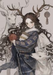 1girl absurdres animal_ears antlers ball blue_kimono blush brown_hair deer deer_ears fur-trimmed_sleeves fur_trim green_eyes highres holding holding_ball horns japanese_clothes kimono long_hair looking_at_viewer original pale_skin parted_bangs parted_lips sayoko_(sayosny2) solo temari_ball very_long_hair wavy_hair winter