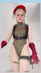 1girl animated ass audible_music bare_legs bare_shoulders blonde_hair blue_eyes braid brazilian_(nationality) breasts cammy_white cammy_white_(cosplay) clenched_hands cosplay curvy fingerless_gloves freckles gloves grin happy hat highleg highleg_leotard highres leotard long_hair medium_breasts memepantazis pale_skin photo_(medium) real_life scar scar_on_face sleeveless smile sound street_fighter street_fighter_6 tagme tongue tongue_out twin_braids v video walking wide_hips