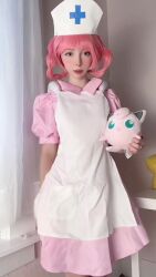 Rule 34 | 1girl, animated, apron, apron pull, arm tattoo, ass, blush, breasts, character doll, clothes pull, cosplay, cosplay photo, doll, dress, female focus, gen 1 pokemon, grabbing own breast, hat, highres, holding, huge ass, huge filesize, jewelry, jiggle, jigglypuff, joy (pokemon), joy (pokemon) (cosplay), looking at viewer, miamiaxof, naked apron, navel, necklace, nintendo, nipples, nurse, nurse cap, petite, photo (medium), pink dress, pink hair, pokemon, pokemon (anime), real life, small breasts, smile, solo, sound, spanking, spanking self, standing, tagme, tattoo, twintails, video, white apron, white hat