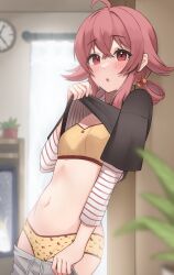 1girl absurdres ahoge black_shirt blurry blurry_background blurry_foreground blush bra breasts clothes_lift clothes_pull depth_of_field grey_pants hair_rings highres idolmaster idolmaster_cinderella_girls indoors komiya_kaho layered_shirt lifting_own_clothes looking_at_viewer navel panties pants pants_pull pulling_own_clothes pyonsan red_eyes red_hair shirt shirt_lift small_breasts solo stomach sweatdrop torso_flash underwear yellow_bra yellow_panties