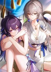2girls ahoge alternate_costume blue_eyes bronya_rand corrupted_twitter_file crossed_bangs earrings floating_earrings grey_eyes hair_between_eyes hair_brush highres holding holding_another&#039;s_hair holding_hair_brush honkai:_star_rail honkai_(series) jewelry knee_up long_hair mie_xing multiple_girls necklace seele_(honkai:_star_rail) smile