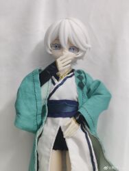 1girl absurdres character_doll chinese_clothes colored_eyelashes doll figure grey_eyes hand_to_own_mouth highres long_sleeves photo_(medium) photo_background realistic short_hair short_shorts shorts vocaloid vsinger_(vocaloid) watermark weibo_username weibo_watermark white_background white_eyelashes white_hair wide_sleeves yanhe yanhe_(daojianchunqiu)