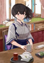 1girl black_hair blue_hakama blush book breasts brown_eyes chair commission cup curtains cushion day desk food grey_kimono hair_between_eyes hakama highres holding holding_cup indoors japanese_clothes kaga_(kancolle) kanmiya_shinobu kantai_collection kimono looking_at_viewer medium_breasts parted_lips plant ponytail potted_plant ribbon-trimmed_sleeves ribbon_trim side_ponytail sitting skeb_commission solo steam table tasuki teapot tray wide_sleeves window yunomi