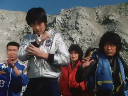 2girls 3boys animated black_eyes black_hair bodysuit boots choudenshi_bioman electricity fingerless_gloves gloves henshin jacket multiple_boys multiple_girls outdoors pants photo_(medium) racing_suit red_pants robot shoes skirt sound spandex super_sentai sweater tagme tokusatsu transformation video