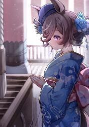 1girl absurdres animal_ears backlighting blue_flower blue_hat blue_kimono blue_rose box brown_hair closed_mouth commentary day donation_box flower from_side furisode hair_flower hair_ornament hat hat_flower hatsumoude hero_(10cl3) highres horse_ears horse_girl horse_tail japanese_clothes kimono light_frown long_sleeves looking_to_the_side new_year obi ponytail praying print_kimono purple_eyes rice_shower_(umamusume) rose sash short_hair short_ponytail solo standing tail temple tilted_headwear umamusume