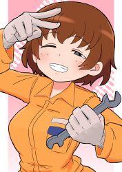 1girl absurdres brown_eyes brown_hair caterpillar_tracks commentary girls_und_panzer gloves grey_gloves grin half-closed_eye highres holding holding_wrench jumpsuit long_sleeves mechanic one_eye_closed orange_jumpsuit pink_background short_hair smile solo tsuchiya_(girls_und_panzer) upper_body v v_over_eye wrench yb_norio