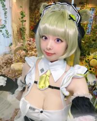Rule 34 | breasts, cleavage, cosplay, goddess of victory: nikke, green hair, highres, large breasts, maid, maid headdress, moyoko otsuki, necktie, photo (medium), purple eyes, selfie, soda (nikke), soda (nikke) (cosplay)