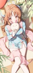 1girl abe_nana arm_support steamed_bun blue_dress blurry brown_eyes brown_hair bun_cover china_dress chinese_clothes commentary_request depth_of_field double_bun dress food food_in_mouth from_above hair_bun highres holding holding_food idolmaster idolmaster_cinderella_girls long_sleeves looking_at_viewer ningen_mame short_dress side_slit sitting solo
