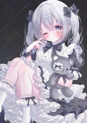 1girl bandaid bandaid_on_knee bandaid_on_leg black_background black_bow black_bowtie black_dress blush bow bowtie center_frills closed_mouth dress drill_hair frills grey_eyes grey_hair hair_bow highres holding holding_stuffed_toy long_hair one_eye_closed original petticoat puffy_short_sleeves puffy_sleeves puu_(kari---ume) short_sleeves sitting socks solo stuffed_animal stuffed_toy tareme teddy_bear twin_drills white_socks