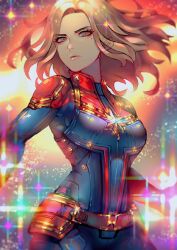 1girl absurdres belt blonde_hair blue_bodysuit bodysuit breasts brown_belt captain_marvel captain_marvel_(movie) carol_danvers closed_mouth commentary_request grey_eyes highres jigenn lips long_hair looking_at_viewer mandarin_collar marvel marvel_cinematic_universe medium_breasts mole mole_under_eye red_bodysuit solo sparkle standing star_(symbol) superhero_costume two-tone_bodysuit v-shaped_eyebrows