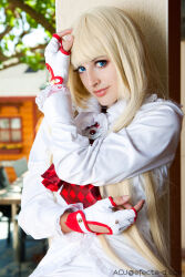 Rule 34 | 1girl, blonde hair, blue eyes, cosplay, emilie de rochefort, emilie de rochefort (cosplay), fingerless gloves, gloves, hand on own face, ivychann, long hair, long sleeves, looking at viewer, photo (medium), real life, spanish (nationality), tekken, tree