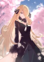 1girl black_coat black_eyes black_pants blonde_hair blurry blurry_background cherry_blossoms coat cowboy_shot cynthia_(pokemon) hair_over_one_eye highres long_hair nintendo outdoors pants petals pokemon pokemon_dppt ringosan2329 solo standing tree very_long_hair