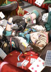 1boy absurdres aventurine_(honkai:_star_rail) black_jacket blonde_hair blue_shirt bracelet card casino clothing_cutout coin collared_shirt fur-trimmed_jacket fur_trim gloves hair_between_eyes half_gloves highres honkai:_star_rail honkai_(series) indoors jacket jewelry koukai_sita long_sleeves looking_at_viewer lying male_focus poker ring shirt smile solo squatting table watch wristwatch