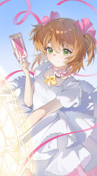 1girl brown_hair card cardcaptor_sakura closed_mouth dress green_eyes harutatsunoki highres holding holding_card kinomoto_sakura kinomoto_sakura_(astral_sakura) layered_dress magical_girl medium_hair pink_ribbon ribbon short_sleeves smile solo two_side_up white_dress