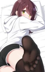 1girl black_shorts black_thighhighs brown_hair dolphin_shorts feet female_focus foot_focus from_behind green_eyes highres hood hood_down hoodie long_sleeves looking_at_viewer looking_back lying medium_hair nekosination on_bed on_stomach panties pillow shorts solo thighhighs toes toki_ayano twitter_username underwear upshorts white_hoodie white_panties yurucamp