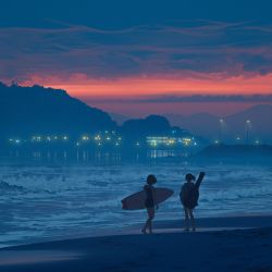 2girls absurdres bare_shoulders barefoot beach blue_theme bysau cloud faceless full_body guitar_case hand_in_pocket hidden_face highres hill hood hoodie instrument_case lights multiple_girls ocean one-piece_swimsuit original outdoors ponytail reflection reflective_water sand short_hair sleeveless standing sunset surfboard swimsuit waves wide_shot