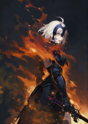 1girl ahoge armor armored_dress back backless_outfit black_dress breasts burning cowboy_shot dress fate/grand_order fate_(series) faulds fire gauntlets hair_between_eyes headpiece highres holding holding_sword holding_weapon iamc95 jeanne_d&#039;arc_alter_(avenger)_(fate) jeanne_d&#039;arc_alter_(fate) looking_at_viewer looking_back medium_breasts parted_lips shade short_hair solo standing sword teeth thighs tongue torn_clothes weapon white_hair yellow_eyes