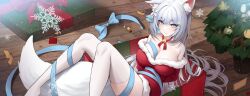 1girl animal_ear_fluff animal_ears arms_behind_back bare_shoulders bell blue_eyes blue_ribbon box breasts christmas christmas_tree cleavage collarbone commentary dress english_commentary erbium flower fox_ears fox_girl fox_tail gift gift_box hair_between_eyes hair_flower hair_ornament hair_spread_out highres indoors jingle_bell knees_up large_breasts light_particles light_smile long_hair looking_at_viewer lying reclining ribbon santa_costume santa_dress sidelocks snowflakes solo tail thighhighs very_long_hair virtual_youtuber vulpixie_(vtuber) white_hair white_thighhighs wild/card wooden_floor wrapped_up