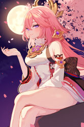 1girl absurdres bare_shoulders breasts cherry_blossoms closed_mouth commentary crossed_legs detached_sleeves falling_petals feet_out_of_frame full_moon genshin_impact hair_between_eyes hair_ornament highres ichi_(iti_iti) japanese_clothes large_breasts looking_at_viewer moon night night_sky petals pink_hair pink_petals purple_eyes purple_sky sitting sky sleeveless smile solo thighs white_sleeves yae_miko