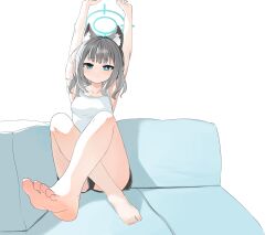 1girl absurdres animal_ear_fluff animal_ears arms_up bare_arms bare_legs bare_shoulders barefoot black_shorts blue_archive blue_eyes blush breasts camisole closed_mouth commentary_request couch dokomon dolphin_shorts grey_hair halo highres korean_commentary medium_breasts on_couch shiroko_(blue_archive) short_shorts shorts simple_background soles solo stretching toes white_background white_camisole wolf_ears