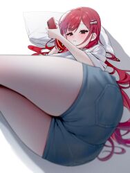1girl absurdres agnamore akane_lize ass blush cellphone denim denim_shorts hair_ornament highres holding holding_phone long_hair looking_at_viewer lying mole mole_under_eye on_side parted_lips phone red_eyes red_hair shirt short_sleeves shorts sidelocks smartphone solo stellive white_shirt