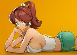 1girl ass bare_shoulders blue_eyes breasts brown_hair closed_mouth crown earrings flower_earrings green_shorts highres jewelry large_breasts long_hair looking_at_viewer lying mario_(series) midriff nintendo on_stomach ponytail princess_daisy selvish94 shorts sideboob simple_background solo tank_top white_tank_top
