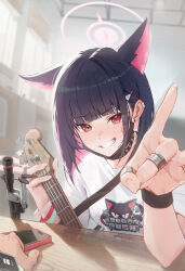 1girl 1other absurdres anger_vein animal_ears bass_guitar black_collar black_hair black_mask blue_archive blurry blurry_background cat_ears cat_girl clenched_teeth collar colored_inner_hair commentary ear_bar extra_ears guan_byeol hair_ornament hairclip halo highres holding holding_instrument indoors instrument jewelry kazusa_(band)_(blue_archive) kazusa_(blue_archive) looking_at_viewer mask mask_lift mouth_mask multicolored_hair official_alternate_costume phone pink_hair pink_halo pov pov_hands print_shirt red_eyes ring shirt teeth upper_body white_shirt