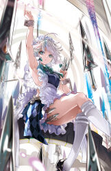 1girl apron armpits arms_up between_fingers blush braid green_ribbon grey_hair highres holding holding_knife izayoi_sakuya knife knives_between_fingers l.f. long_hair looking_at_viewer maid maid_apron maid_headdress ribbon short_hair sitting socks solo touhou twin_braids waist_apron white_socks wrist_cuffs