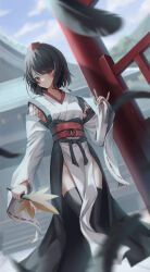 1girl black_hair black_thighhighs blue_sky blurry depth_of_field fall_(5754478) falling_feathers feathers hand_fan hat highres holding holding_fan kourindou_tengu_costume looking_at_viewer obi outdoors red_eyes sash shameimaru_aya short_hair shrine sky solo thighhighs thighs tokin_hat touhou wide_sleeves