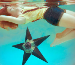 1girl afloat aqua_background armpits barefoot closed_eyes cosplay cosplay_photo denim denim_shorts feet female_focus floating gen_1_pokemon image_sample misty_(pokemon) nintendo orange_hair photo_(medium) pokemon pokemon_(anime) shirt short_hair short_shorts shorts sleeveless sleeveless_shirt solo star_(symbol) staryu suspenders tank_top underwater water windnstorm yellow_shirt