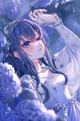 1girl blue_eyes blue_hair blurry blurry_foreground blush collarbone depth_of_field double-parted_bangs dress ear_flower flower hair_between_eyes hand_up highres jewelry long_eyelashes long_hair open_mouth original ring satori_suzuha sidelocks solo tearing_up twitter_username water_drop watermark white_dress
