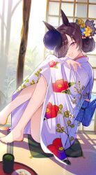 1girl absurdres alternate_costume alternate_hairstyle animal_ears architecture barefoot blue_flower blush brown_hair east_asian_architecture floral_print floral_print_kimono flower green_tea hair_bun hair_flower hair_ornament hair_over_one_eye highres horse_ears horse_girl hugging_own_legs indoors japanese_clothes kimono looking_at_viewer open_mouth print_kimono purple_eyes purple_kimono rice_shower_(umamusume) solo tea tree umamusume yellow_flower yomean!