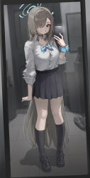 1girl absurdres asuna_(blue_archive) black_shoes black_socks blue_archive blue_eyes blue_halo breasts brown_hair cellphone cleavage collared_shirt commentary_request full_body grin hair_over_one_eye halo hand_up highres holding holding_phone indoors large_breasts long_hair looking_at_mirror mirror one_eye_covered phone school_uniform shirt shirt_tucked_in shoes sleeves_rolled_up smartphone smile socks solo summer_(724788381) very_long_hair white_shirt