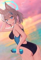 1girl animal_ear_fluff animal_ears ass bare_arms blue_archive blue_eyes blurry blurry_background blush bottle breasts competition_swimsuit cowboy_shot cross_hair_ornament dutch_angle from_side grey_hair hair_ornament halo highres holding holding_bottle looking_at_viewer medium_breasts mismatched_pupils one-piece_swimsuit pn_(wnsl216) shiroko_(blue_archive) shiroko_(swimsuit)_(blue_archive) sidelocks smile solo swimsuit two-tone_swimsuit water_bottle wet