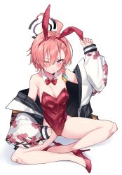 1girl ahoge animal_ears asymmetrical_bangs bandaid bandaid_on_knee bandaid_on_leg bare_legs blue_archive bow bowtie braid commentary detached_collar fake_animal_ears flat_chest haruyuki_(yukichasoba) highres indian_style jacket leotard mole mole_under_eye neru_(blue_archive) neru_(bunny)_(blue_archive) one_eye_closed orange_hair oversized_breast_cup playboy_bunny print_jacket rabbit_ears red_eyes red_leotard simple_background single_braid sitting solo strapless strapless_leotard sukajan symbol-only_commentary tag traditional_bowtie white_background