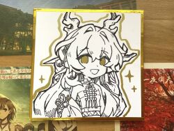 1girl :d arknights bare_shoulders chibi chibi_only chinese_commentary commentary_request dragon_girl dragon_horns hair_between_eyes hair_intakes hand_up highres horns jewelry juruoxiaoyan looking_at_viewer monochrome necklace off_shoulder open_mouth photo_(medium) shikishi shu_(arknights) smile solo sparkle strapless traditional_media tube_top