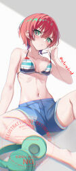 1girl amate_yuzuriha bare_arms bare_shoulders barefoot bikini blue_shorts breasts closed_mouth commentary_request feet_out_of_frame green_eyes grey_background gundam gundam_gquuuuuux hair_between_eyes hand_up headphones headphones_removed highres looking_at_viewer medium_breasts natuna_natu navel red_hair shorts sitting solo strap_lift striped_bikini striped_clothes swimsuit twitter_username v-shaped_eyebrows watermark