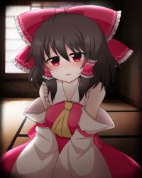 1girl ascot bare_shoulders between_breasts blush bow breasts brown_hair commentary_request detached_sleeves female_focus hair_bow hair_tubes hakurei_reimu hakurei_shrine head_tilt indoors large_bow looking_at_viewer medium_breasts open_mouth red_eyes shiohachi short_hair solo touhou v_arms