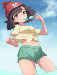Rule 34 | 1girl, beanie, black hair, blue sky, blush, breasts, cloud, food, food in mouth, green shorts, hat, hiyoshipow, holding, holding food, holding popsicle, looking at viewer, medium breasts, midriff, navel, nintendo, outdoors, pokemon, pokemon sm, popsicle, popsicle in mouth, red hat, selene (pokemon), shirt, short hair, short sleeves, shorts, simple background, sky, sweat, sweatdrop, tied shirt, water, yellow shirt