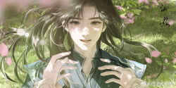 1boy armor black_hanfu brown_hair chinese_clothes chinese_commentary chu_wanning erha_he_tadebai_mao_shizun falling_petals flower grass hanfu highres holding_another&#039;s_wrists long_hair looking_at_viewer male_focus mo_ran out_of_frame outdoors petals pink_flower pink_petals purple_eyes shoulder_armor smile upper_body watermark weibo_watermark wind wind_lift zhou_ying_na