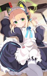 1girl absurdres animal_ear_headphones animal_ears apron black_dress blonde_hair blue_archive blunt_bangs blush broom cat_ear_headphones commentary_request cowboy_shot dispersion_(optics) dress fake_animal_ears frilled_apron frills green_eyes green_halo halo handheld_game_console headphones highres indoors kawtorikomi long_sleeves looking_at_viewer lying maid maid_apron maid_headdress midori_(blue_archive) midori_(maid)_(blue_archive) official_alternate_costume open_mouth pantyhose puffy_sleeves short_hair sidelocks solo tail tamagotchi tamagotchi_(virtual_pet) white_apron
