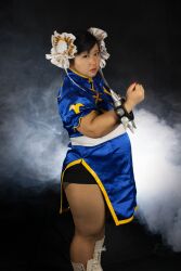 1girl asian black_hair capcom chun-li fat fat_woman female_focus highres photo_(medium) sakuran_watanabe solo street_fighter