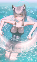 1girl absurdres animal_ear_fluff animal_ears black_one-piece_swimsuit blue_archive blue_hair cross_hair_ornament domi_(hongsung0819) grey_hair hair_between_eyes hair_ornament highres long_hair looking_at_viewer ocean official_alternate_costume official_alternate_hairstyle one-piece_swimsuit partially_submerged ponytail shiroko_(blue_archive) shiroko_(swimsuit)_(blue_archive) sidelocks solo swim_ring swimsuit wolf_ears wolf_girl
